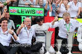 Race winner Nico Rosberg (GER) Mercedes AMG F1 celebrates with Toto Wolff (GER) Mercedes AMG F1 Shareholder and Executive Director, Dr. Dieter Zetsche (GER) Daimler AG CEO and the team. 11.05.2014. Formula 1 World Championship, Rd 5, Spanish Grand Prix, Barcelona, Spain, Race Day.