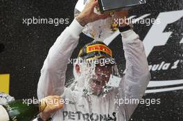 Race winner Lewis Hamilton (GBR) Mercedes AMG F1 celebrates with the champagne on the podium. 11.05.2014. Formula 1 World Championship, Rd 5, Spanish Grand Prix, Barcelona, Spain, Race Day.