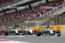 Lewis Hamilton (GBR) Mercedes AMG F1 W05 leads team mate Nico Rosberg (GER) Mercedes AMG F1 W05 at the start of the race. 11.05.2014. Formula 1 World Championship, Rd 5, Spanish Grand Prix, Barcelona, Spain, Race Day.