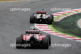 Romain Grosjean (FRA) Lotus F1 E22 leads Kimi Raikkonen (FIN) Ferrari F14-T. 11.05.2014. Formula 1 World Championship, Rd 5, Spanish Grand Prix, Barcelona, Spain, Race Day.
