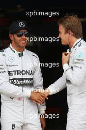 (L to R): Lewis Hamilton (GBR) Mercedes AMG F1 celebrates his pole position in parc ferme with second placed team mate Nico Rosberg (GER) Mercedes AMG F1. 10.05.2014. Formula 1 World Championship, Rd 5, Spanish Grand Prix, Barcelona, Spain, Qualifying Day.