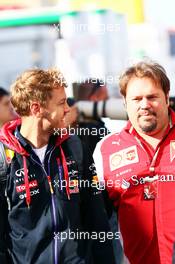 Sebastian Vettel (GER) Red Bull Racing with Gino Rosato (CDN) Ferrari. 10.05.2014. Formula 1 World Championship, Rd 5, Spanish Grand Prix, Barcelona, Spain, Qualifying Day.