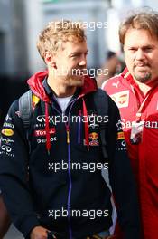 Sebastian Vettel (GER) Red Bull Racing with Gino Rosato (CDN) Ferrari. 10.05.2014. Formula 1 World Championship, Rd 5, Spanish Grand Prix, Barcelona, Spain, Qualifying Day.