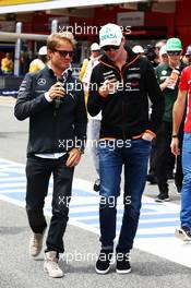 (L to R): Nico Rosberg (GER) Mercedes AMG F1 with Nico Hulkenberg (GER) Sahara Force India F1 on the drivers parade. 11.05.2014. Formula 1 World Championship, Rd 5, Spanish Grand Prix, Barcelona, Spain, Race Day.