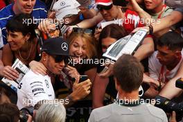 Lewis Hamilton (GBR) Mercedes AMG F1 takes a selfie with the fans in the pits. 08.05.2014. Formula 1 World Championship, Rd 5, Spanish Grand Prix, Barcelona, Spain, Preparation Day.