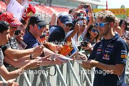 Sebastian Vettel (GER) Red Bull Racing signs autographs for the fans. 08.05.2014. Formula 1 World Championship, Rd 5, Spanish Grand Prix, Barcelona, Spain, Preparation Day.