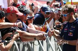 Sebastian Vettel (GER) Red Bull Racing signs autographs for the fans. 08.05.2014. Formula 1 World Championship, Rd 5, Spanish Grand Prix, Barcelona, Spain, Preparation Day.