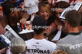 Lewis Hamilton (GBR) Mercedes AMG F1 signs autographs for the fans in the pits. 08.05.2014. Formula 1 World Championship, Rd 5, Spanish Grand Prix, Barcelona, Spain, Preparation Day.