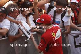Kimi Raikkonen (FIN) Ferrari signs autographs for the fans. 08.05.2014. Formula 1 World Championship, Rd 5, Spanish Grand Prix, Barcelona, Spain, Preparation Day.