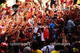 Fernando Alonso (ESP) Ferrari takes a 'selfie' with the fans in the pits. 08.05.2014. Formula 1 World Championship, Rd 5, Spanish Grand Prix, Barcelona, Spain, Preparation Day.