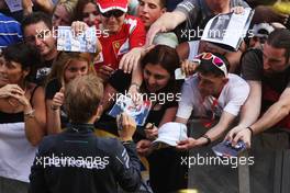 Nico Rosberg (GER) Mercedes AMG F1 signs autographs for the fans in the pits. 08.05.2014. Formula 1 World Championship, Rd 5, Spanish Grand Prix, Barcelona, Spain, Preparation Day.