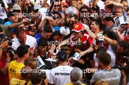 Lewis Hamilton (GBR) Mercedes AMG F1 with fans in the pits. 08.05.2014. Formula 1 World Championship, Rd 5, Spanish Grand Prix, Barcelona, Spain, Preparation Day.