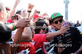 Sergio Perez (MEX) Sahara Force India F1 with fans in the pits. 08.05.2014. Formula 1 World Championship, Rd 5, Spanish Grand Prix, Barcelona, Spain, Preparation Day.