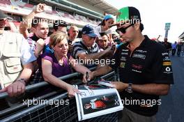 Sergio Perez (MEX) Sahara Force India F1 signs autographs for the fans in the pits. 08.05.2014. Formula 1 World Championship, Rd 5, Spanish Grand Prix, Barcelona, Spain, Preparation Day.