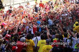 Fernando Alonso (ESP) Ferrari takes a 'selfie' with fans in the pits. 08.05.2014. Formula 1 World Championship, Rd 5, Spanish Grand Prix, Barcelona, Spain, Preparation Day.