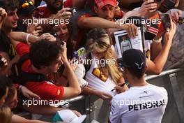 Lewis Hamilton (GBR) Mercedes AMG F1 signs autographs for the fans in the pits. 08.05.2014. Formula 1 World Championship, Rd 5, Spanish Grand Prix, Barcelona, Spain, Preparation Day.
