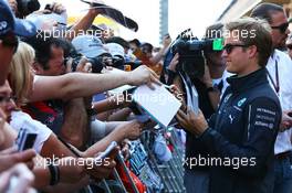 Nico Rosberg (GER) Mercedes AMG F1 signs autographs for the fans in the pits. 08.05.2014. Formula 1 World Championship, Rd 5, Spanish Grand Prix, Barcelona, Spain, Preparation Day.
