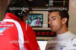 Jules Bianchi (FRA) Marussia F1 Team with Francesco Nenci (ITA) Marussia F1 Team Race Engineer. 04.07.2014. Formula 1 World Championship, Rd 9, British Grand Prix, Silverstone, England, Practice Day.