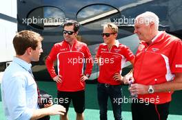 (L to R): Anthony Davidson (GBR) with Marc Hynes (GBR) Marussia F1 Team Driver Coach; Max Chilton (GBR) Marussia F1 Team; and John Booth (GBR) Marussia F1 Team Team Principal. 04.07.2014. Formula 1 World Championship, Rd 9, British Grand Prix, Silverstone, England, Practice Day.