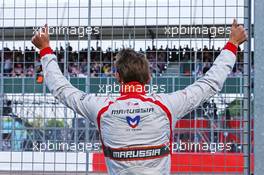 Max Chilton (GBR) Marussia F1 Team acknowledges the fans in the granstand. 04.07.2014. Formula 1 World Championship, Rd 9, British Grand Prix, Silverstone, England, Practice Day.