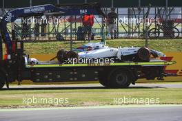 The Williams FW36 of Felipe Massa (BRA) Williams is recovered back to the pits on the back of a truck after he crashed in FP1. 04.07.2014. Formula 1 World Championship, Rd 9, British Grand Prix, Silverstone, England, Practice Day.