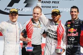 The podium (L to R): Nico Rosberg (GER) Mercedes AMG F1, second; Lewis Hamilton (GBR) Mercedes AMG F1, race winner; Daniel Ricciardo (AUS) Red Bull Racing, third. 06.07.2014. Formula 1 World Championship, Rd 9, British Grand Prix, Silverstone, England, Race Day.