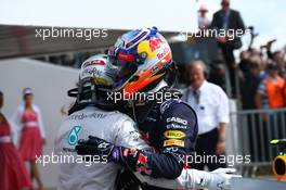 Lewis Hamilton (GBR) Mercedes AMG F1 W05 and Daniel Ricciardo (AUS) Red Bull Racing RB10. 06.07.2014. Formula 1 World Championship, Rd 9, British Grand Prix, Silverstone, England, Race Day.