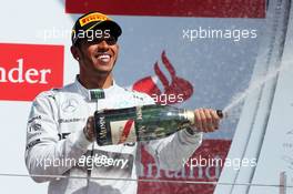 Race winner Lewis Hamilton (GBR) Mercedes AMG F1 celebrates on the podium. 06.07.2014. Formula 1 World Championship, Rd 9, British Grand Prix, Silverstone, England, Race Day.