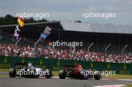 Valtteri Bottas (FIN) Williams FW36 and Sebastian Vettel (GER) Red Bull Racing RB10 battle for position. 06.07.2014. Formula 1 World Championship, Rd 9, British Grand Prix, Silverstone, England, Race Day.
