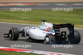 Felipe Massa (BRA) Williams FW36 with a punctured rear tyre and damaged rear suspension. 06.07.2014. Formula 1 World Championship, Rd 9, British Grand Prix, Silverstone, England, Race Day.