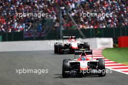 Max Chilton (GBR) Marussia F1 Team MR03 leads team mate Jules Bianchi (FRA) Marussia F1 Team MR03. 06.07.2014. Formula 1 World Championship, Rd 9, British Grand Prix, Silverstone, England, Race Day.