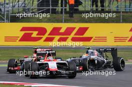 Jules Bianchi (FRA) Marussia F1 Team MR03 leads Pastor Maldonado (VEN) Lotus F1 E21 and Esteban Gutierrez (MEX) Sauber C33, who collide. 06.07.2014. Formula 1 World Championship, Rd 9, British Grand Prix, Silverstone, England, Race Day.