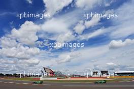 Kamui Kobayashi (JPN) Caterham CT05 leads team mate Marcus Ericsson (SWE) Caterham CT05. 06.07.2014. Formula 1 World Championship, Rd 9, British Grand Prix, Silverstone, England, Race Day.