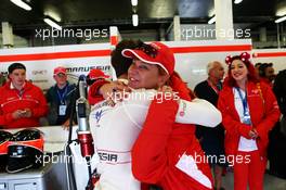 Jules Bianchi (FRA) Marussia F1 Team celebrates during qualifying with Sasha Cheglakov (RUS) Marussia Team Owner. 05.07.2014. Formula 1 World Championship, Rd 9, British Grand Prix, Silverstone, England, Qualifying Day.