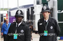 Policemen in the paddock. 05.07.2014. Formula 1 World Championship, Rd 9, British Grand Prix, Silverstone, England, Qualifying Day.