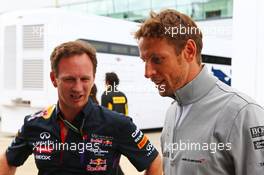 (L to R): Christian Horner (GBR) Red Bull Racing Team Principal with Jenson Button (GBR) McLaren. 05.07.2014. Formula 1 World Championship, Rd 9, British Grand Prix, Silverstone, England, Qualifying Day.