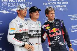 Qualifying top three in parc ferme (L to R): Jenson Button (GBR) McLaren, third; Nico Rosberg (GER) Mercedes AMG F1, pole position; Sebastian Vettel (GER) Red Bull Racing, second. 05.07.2014. Formula 1 World Championship, Rd 9, British Grand Prix, Silverstone, England, Qualifying Day.