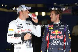(L to R): third placed Jenson Button (GBR) McLaren with second placed Sebastian Vettel (GER) Red Bull Racing in qualifying parc ferme. 05.07.2014. Formula 1 World Championship, Rd 9, British Grand Prix, Silverstone, England, Qualifying Day.