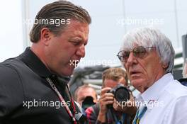 (L to R): Zak Brown (USA) Just Marketing International with Bernie Ecclestone (GBR). 06.07.2014. Formula 1 World Championship, Rd 9, British Grand Prix, Silverstone, England, Race Day.