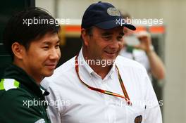 (L to R): Kamui Kobayashi (JPN) Caterham with Nigel Mansell (GBR) FIA Steward. 03.07.2014. Formula 1 World Championship, Rd 9, British Grand Prix, Silverstone, England, Preparation Day.