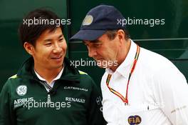 (L to R): Kamui Kobayashi (JPN) Caterham with Nigel Mansell (GBR) FIA Steward. 03.07.2014. Formula 1 World Championship, Rd 9, British Grand Prix, Silverstone, England, Preparation Day.