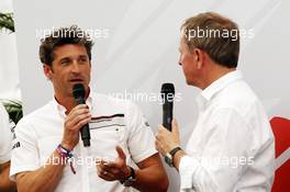 Patrick Dempsey (USA) Actor, taking part in the Porsche Supercup race, with Martin Brundle (GBR) Sky Sports Commentator (Right). 18.07.2014. Formula 1 World Championship, Rd 10, German Grand Prix, Hockenheim, Germany, Practice Day.