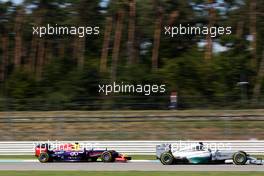 Lewis Hamilton (GBR) Mercedes AMG F1 W05 leads Daniel Ricciardo (AUS) Red Bull Racing RB10. 18.07.2014. Formula 1 World Championship, Rd 10, German Grand Prix, Hockenheim, Germany, Practice Day.