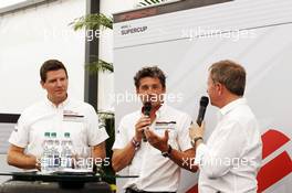 Patrick Dempsey (USA) Actor, taking part in the Porsche Supercup race, with Martin Brundle (GBR) Sky Sports Commentator (Right). 18.07.2014. Formula 1 World Championship, Rd 10, German Grand Prix, Hockenheim, Germany, Practice Day.