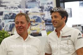 Patrick Dempsey (USA) Actor, taking part in the Porsche Supercup race, with Martin Brundle (GBR) Sky Sports Commentator (Left). 18.07.2014. Formula 1 World Championship, Rd 10, German Grand Prix, Hockenheim, Germany, Practice Day.