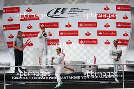 The podium (L to R): Valtteri Bottas (FIN) Williams, second; Nico Rosberg (GER) Mercedes AMG F1, race winner; Lewis Hamilton (GBR) Mercedes AMG F1, third. 20.07.2014. Formula 1 World Championship, Rd 10, German Grand Prix, Hockenheim, Germany, Race Day.