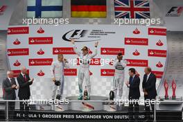 The podium (L to R): Valtteri Bottas (FIN) Williams, second; Nico Rosberg (GER) Mercedes AMG F1, race winner; Lewis Hamilton (GBR) Mercedes AMG F1, third. 20.07.2014. Formula 1 World Championship, Rd 10, German Grand Prix, Hockenheim, Germany, Race Day.