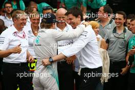 Race winner Nico Rosberg (GER) Mercedes AMG F1 celebrates with Toto Wolff (GER) Mercedes AMG F1 Shareholder and Executive Director and the team. 20.07.2014. Formula 1 World Championship, Rd 10, German Grand Prix, Hockenheim, Germany, Race Day.