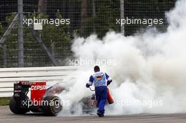 Daniil Kvyat (RUS) Scuderia Toro Rosso STR9 catches fire and retires from the race. 20.07.2014. Formula 1 World Championship, Rd 10, German Grand Prix, Hockenheim, Germany, Race Day.