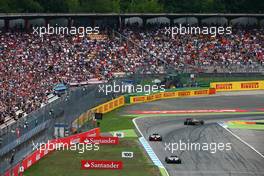 Pastor Maldonado (VEN) Lotus F1 E21 leads Kamui Kobayashi (JPN) Caterham CT05 and Kevin Magnussen (DEN) McLaren MP4-29. 20.07.2014. Formula 1 World Championship, Rd 10, German Grand Prix, Hockenheim, Germany, Race Day.